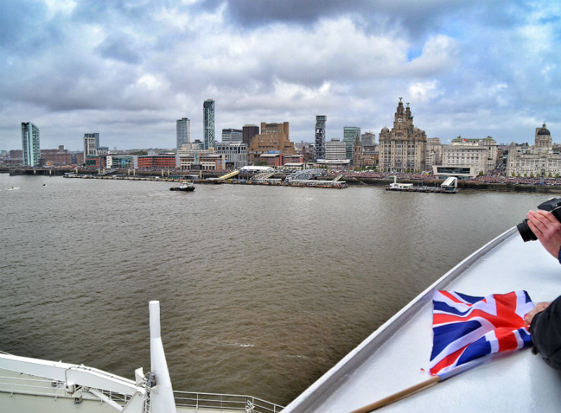 Liverpool's famous Pier Head World Heritage Site skyline under clearing skies from the upper decks of Cunard's Queen Mary 2